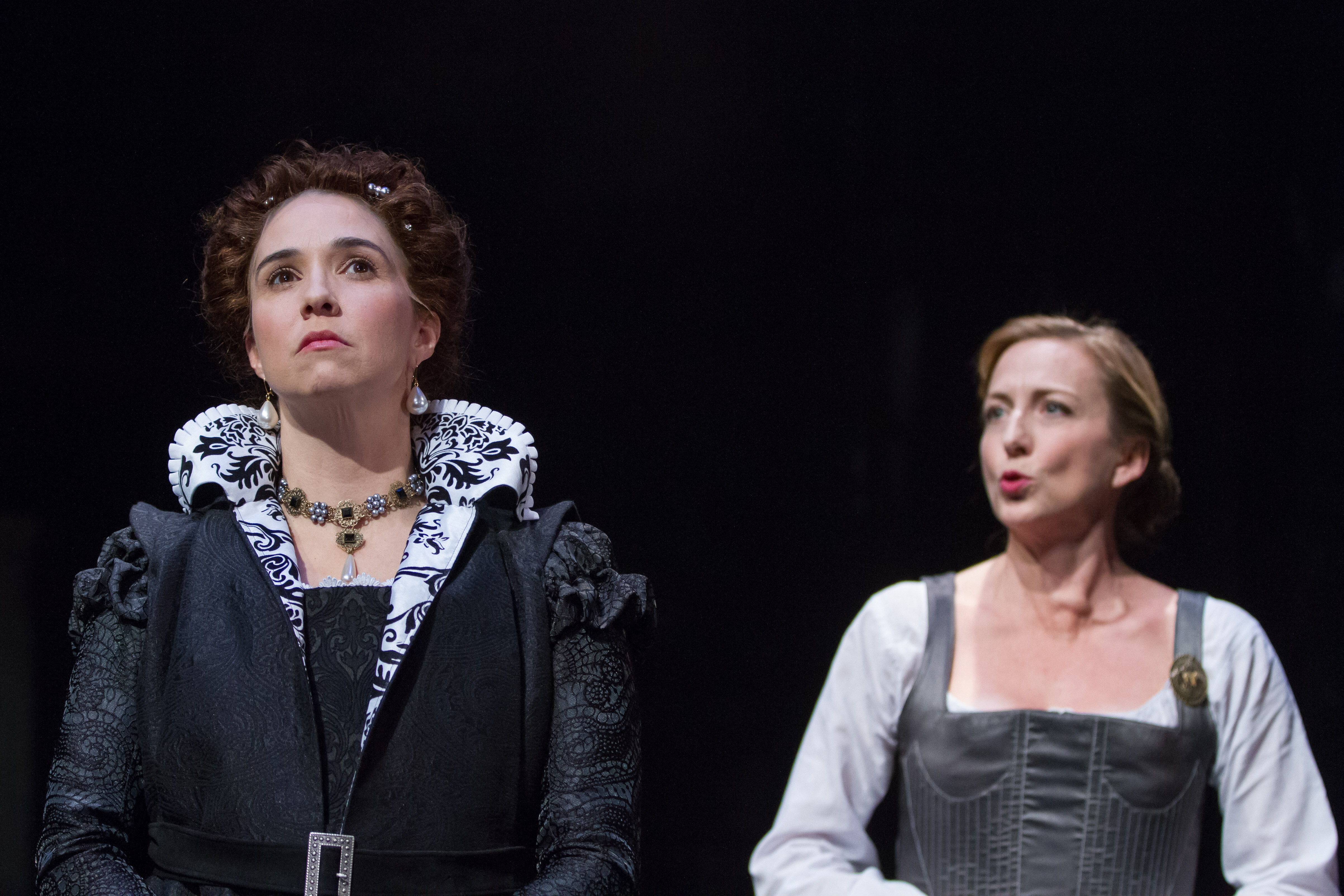 Queen Elizabeth I (Holly Twyford) and Mary Stuart (Kate Eastwood Norris) share an uncomfortable faux moment. Photo courtesy of Teresa Wood/Folger Theatre