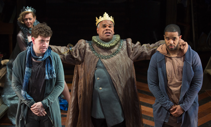 Claudius (Craig Wallace, center) directs Rosencrantz (Romell Witherspoon, right) and Guildenstern (Adam Wesley Brown) to glean what is afflicting Hamlet. Kimberly Schraf pictured in background. Rosencrantz and Guildenstern Are Dead is on stage at Folger Theatre, May 12 – June 28, 2015. Photo by Jeff Malet.