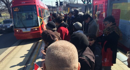 Soon to be a familiar sight, inaugural riders wait for the car to turn around and pick us all up at the Benning and 25th stop. Photo by María Helena Carey.