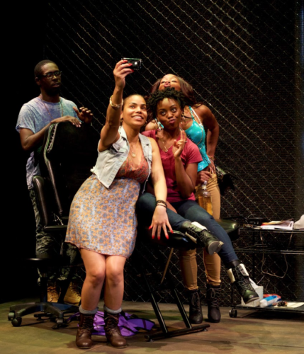 Talisha (Renee Elizabeth Wilson), Annie (Kashayna Johnson) and Margie (Ghislaine Dwarka) pose for a selfie while Antwoine (Jeremy Keith Hunter) looks on. Photo by Ryan Maxwell, courtesy of Mosaic Theater Company.