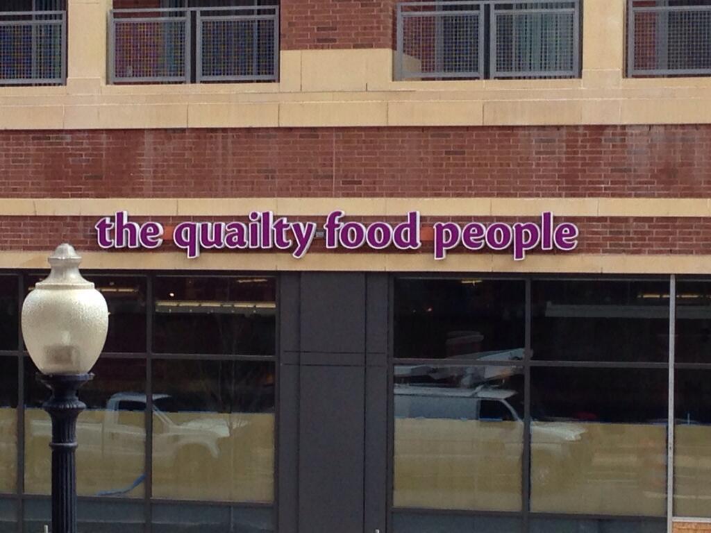 The Giant sign before spell check and a fix to read "quality food people."