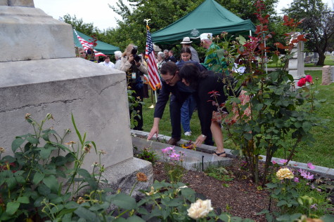 An ancestor of Kate Brosnaham pays his respects at her grave.