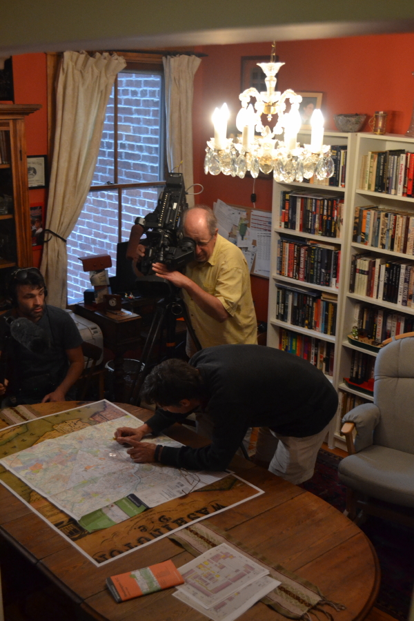 I was holding my magnifying glass so the cameraman could get a shot of the tiny letters 'Gessford Court' on the map.
